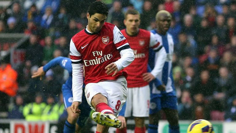 Mikel Arteta secures the spoils at a soggy DW Stadium from the spot