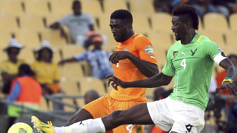 Emmanuel Adebayor and Kolo Toure: Battle for possession in tight contest