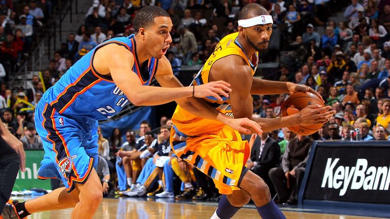 Kevin Martin and Corey Brewer in action