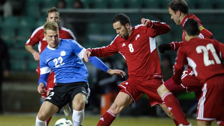 Andorra's Marcio Vieria battles for the ball with Henri Anier