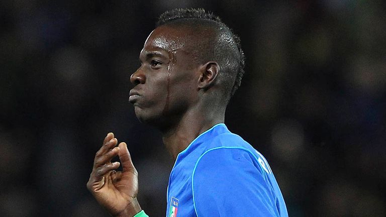 Mario Balotelli: Celebrates his stunning equaliser for Italy