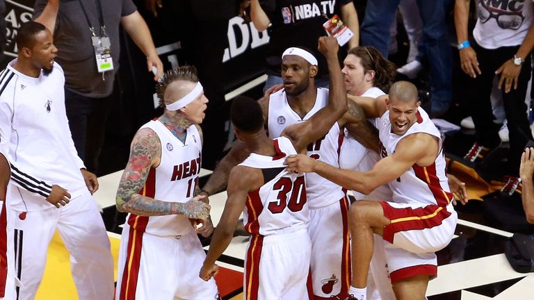 LeBron James (centre) celebrates with team-mates after the buzzer