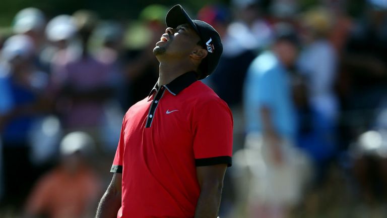 Tiger Woods reacts after missing a putt on the 12th hole during the final round of The Barclays