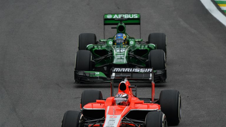 Big boost: Marussia&#39;s Jules Bianchi leads Caterham&#39;s Charles Pic in Brazil