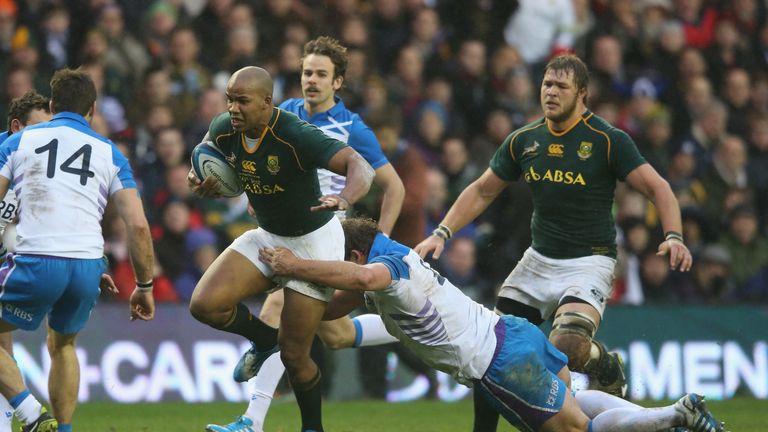 Springboks tryscorer JP Pietersen is tackled by Ross Ford