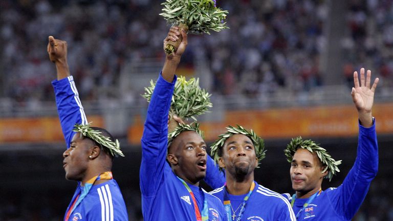 Tony Lester steered Marlon Devonish (centre left) to relay gold at the 2004 Games