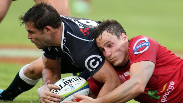 Sharks&#39; Cobus Reinach competes for the ball with Mike Harris of the Reds