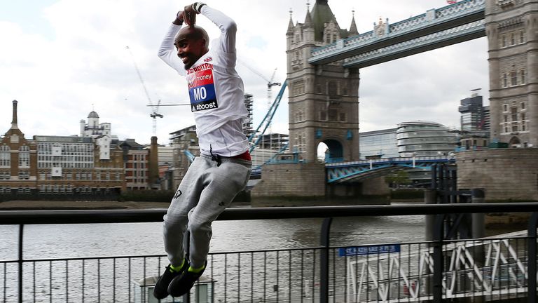 Mo Farah jumps for joy ahead of his marathon debut in London on Sunday