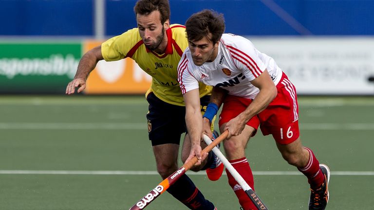 England's Adam Dixon competes for the ball with David Alegre of Spain