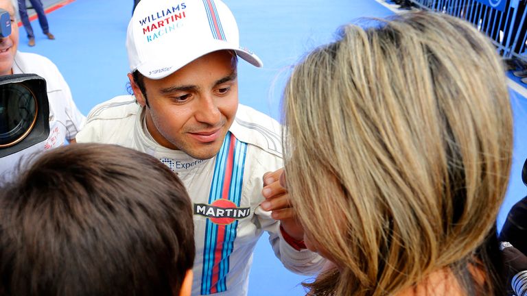 Felipe Massa celebrates with his wife and child