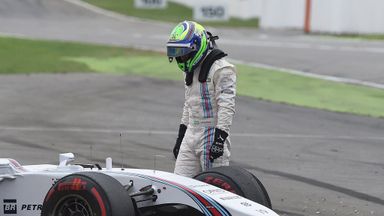 Felipe Massa inspects his car
