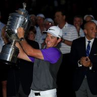 Rory McIlroy celebrates with the Wanamaker trophy after his one-stroke victory