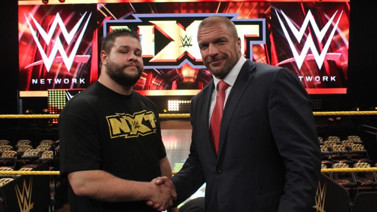Kevin Steen shakes hands with WWE Chief Operating Officer, Triple H