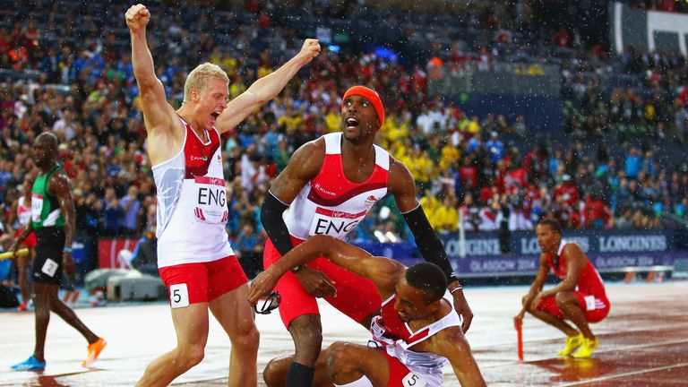 Conrad Williams, Matthew Hudson-Smith and Daniel Awde of England celebrate winning gold in the 4x400 metres 