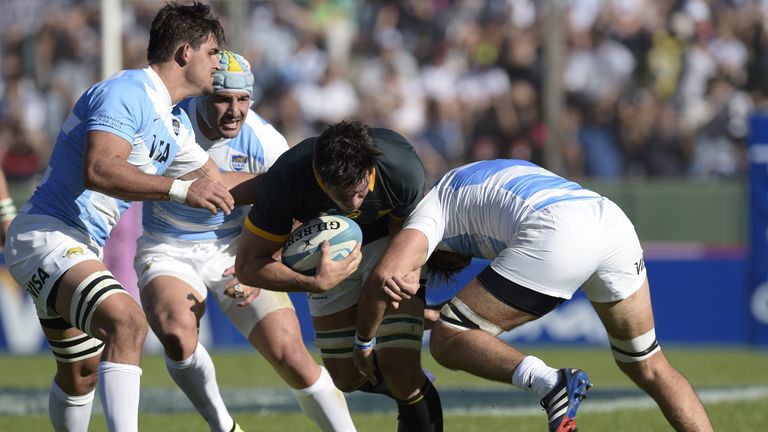 Francois Louw: Tackled by Argentina's Juan Fernandez Lobbe (R) and Pablo Matera (L)