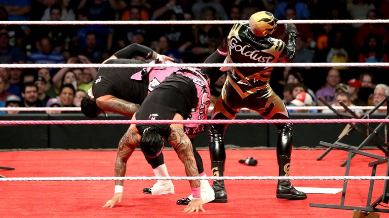 Goldust receives a dual Superkick from Jimmy and Jey Uso