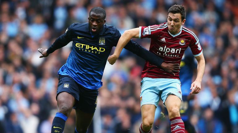 Yaya Toure and Stewart Downing tussle