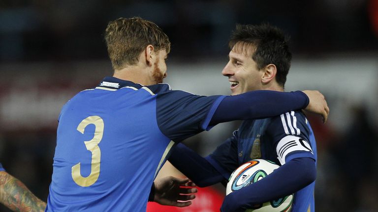Lionel Messi: Celebrates with fellow scorer Christian Ansaldi