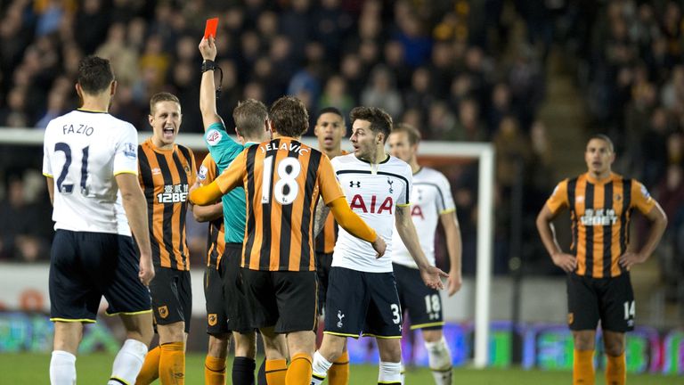Referee Craig Pawson shows Hull City's Uruguayan midfielder Gaston Ramirez a red card