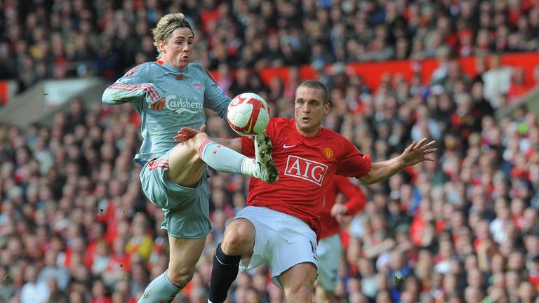 Fernando Torres beats Manchester United's Nemanja Vidic to score in 2009