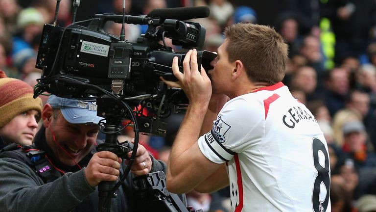 Steven Gerrard celebrates scoring a goal at Old Trafford by kissing a camera