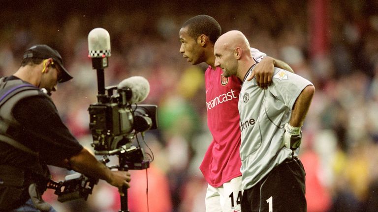 Henry consoles Fabien Barthez after beating him from distance at Highbury in 2000