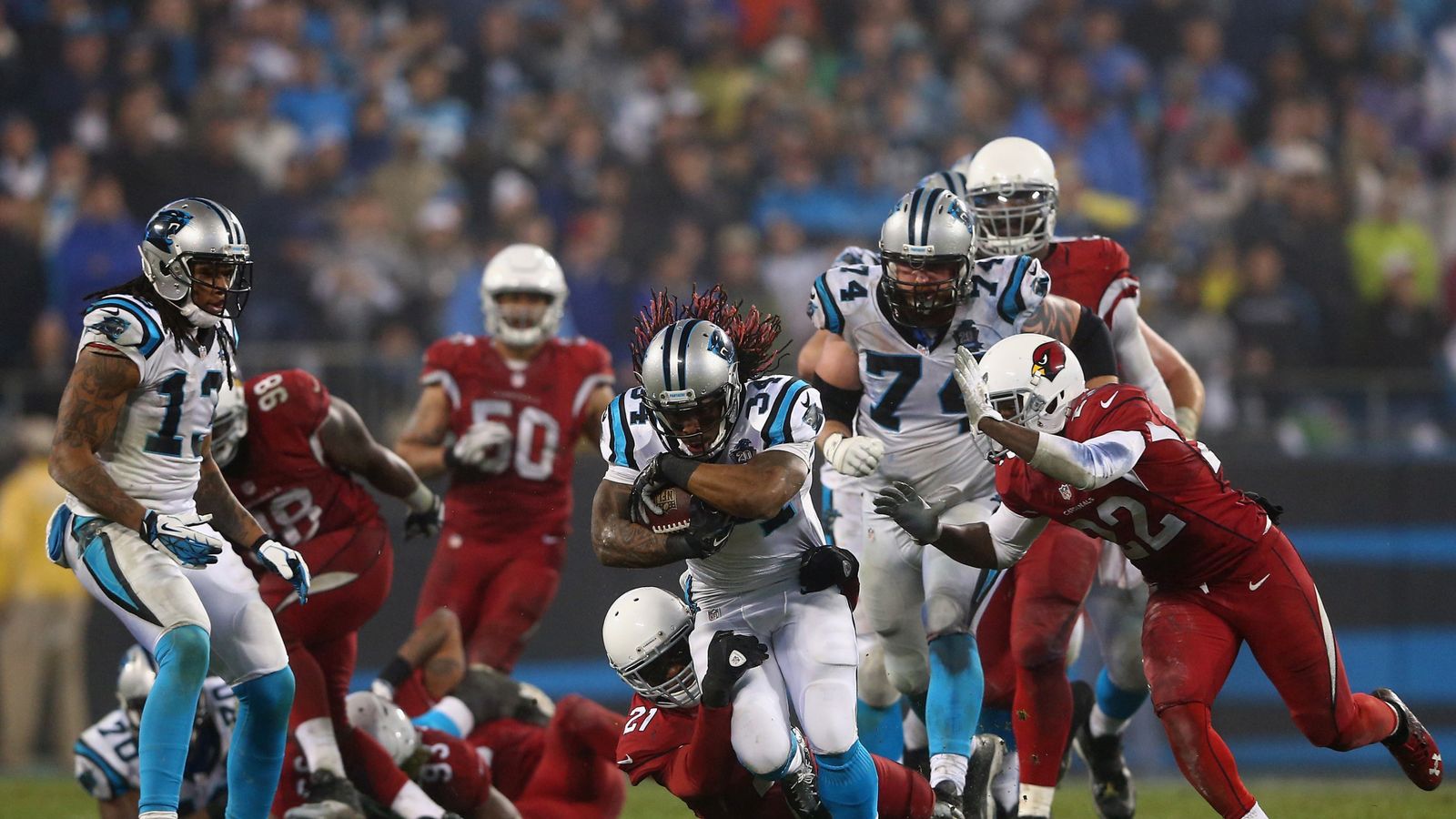 DeAngelo Williams of the Carolina Panthers looks on from the