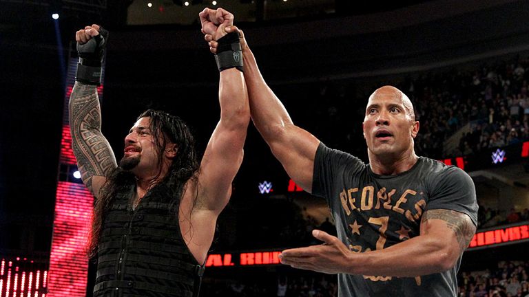 Roman Reigns and The Rock celebrate the former's Rumble victory