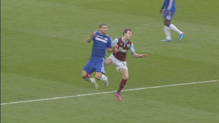 Ashley Barnes appears to foul Branislav Ivanovic.