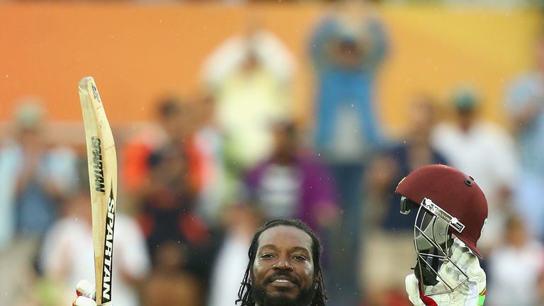 Chris Gayle celebrates his double century as he struck a career-best 215 against Zimbabwe at the last World Cup