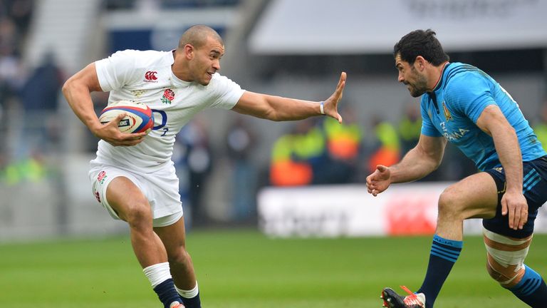 Jonathan Joseph hands off Andrea Masi