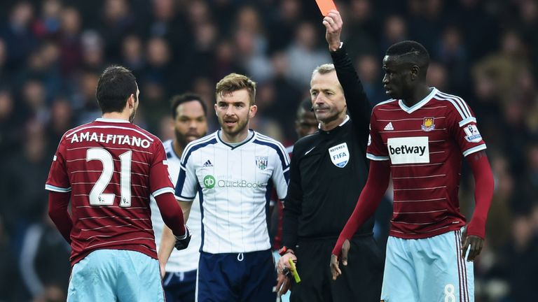 Morgan Amalfitano is shown the red card
