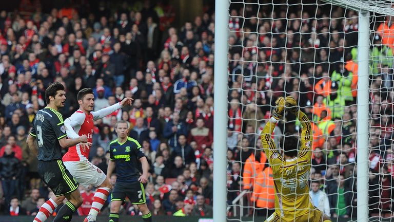Giroud: finishes his second goal superbly from Santi Cazorla's corner