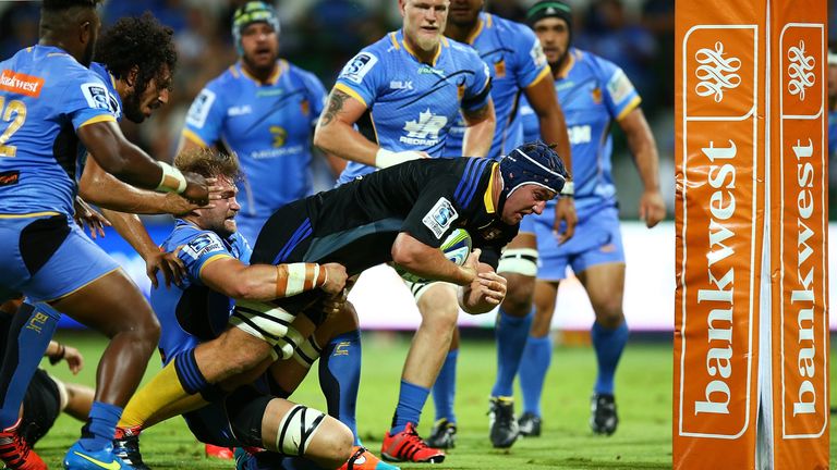 Mark Abbott powers over for the Hurricanes' second try