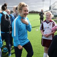 Izzy Christiansen with schoolgirls at the City Academy