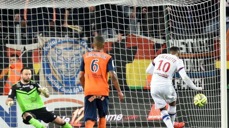Alexandre Lacazette (right) scores a penalty against Montpellier in Ligue 1