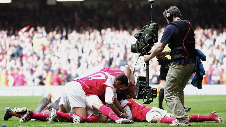 The Arsenal team celebrate Patrick Vieira scoring the last penalty to win the 2005 FA Cup Final