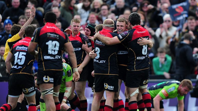 Dragons players celebrate after victory over Cardiff Blues