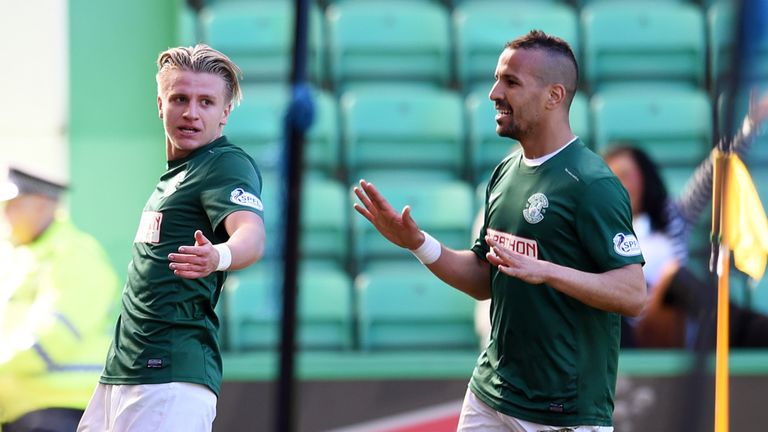 Hibernian's Jason Cummings celebrates with team-mate Farid El Alagui