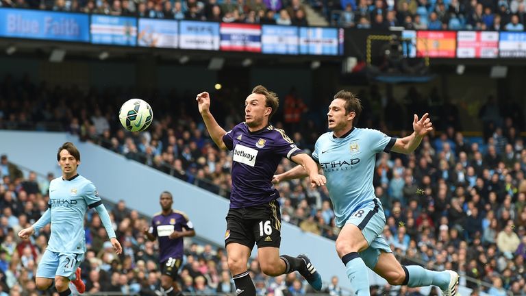 Manchester City's Frank Lampard battles with Mark Noble