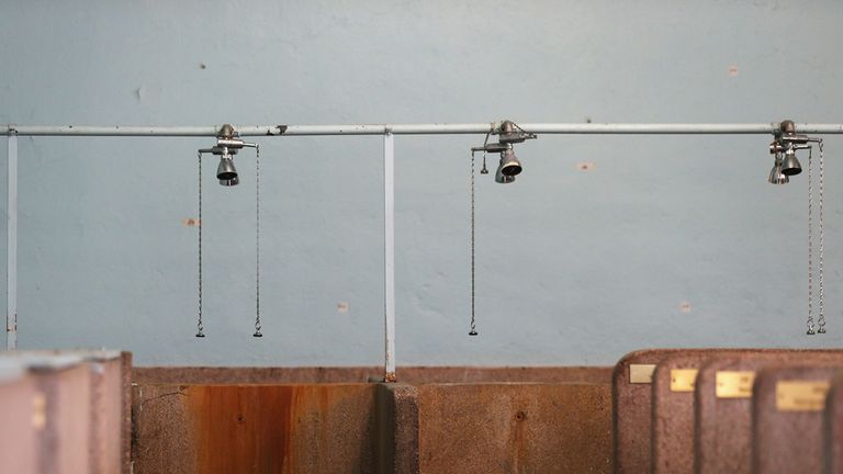 The fabled shower room at the Roubaix Velodrome, complete with plaques carrying names of the winners