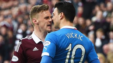 Image of Hearts' Kevin McHattie (left) clashes with Rangers' Haris Vuckic