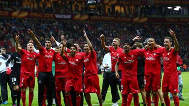 Sevilla players have a trophy and Champions League football to celebrate