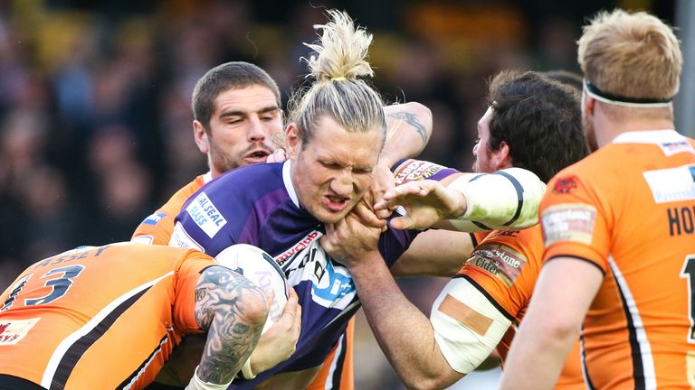 Eorl Crabtree takes on the Castleford's defence.