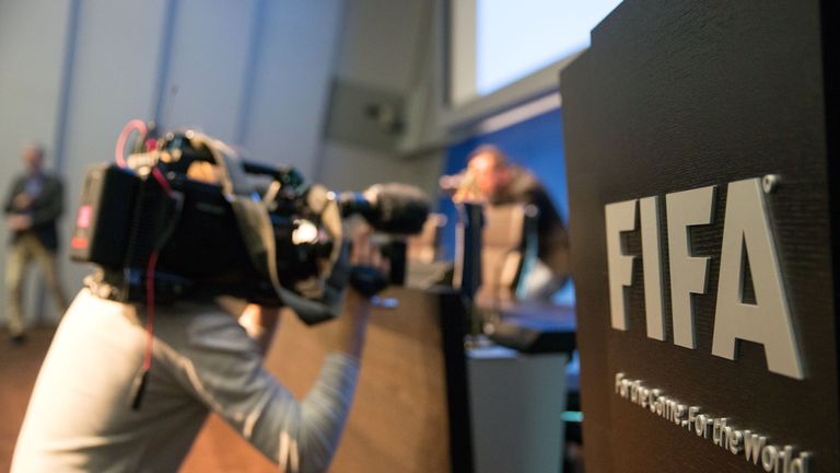 A cameraman attends a press conference at the FIFA headquarters in Zurich, Switzerland following news of Wednesday's arrests.