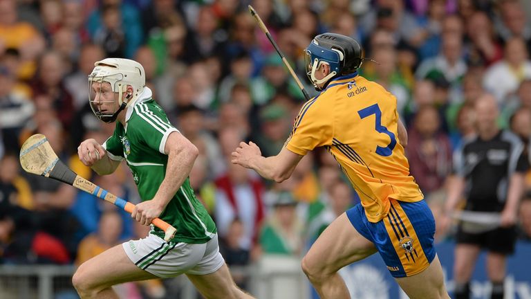 Cian Lynch, Limerick, in action against David McInerney, Clare