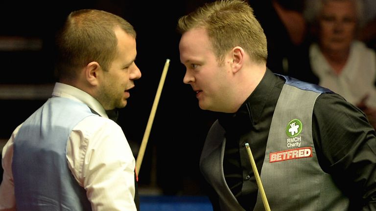Shaun Murphy shakes hands with Barry Hawkins after defeating him 17-9