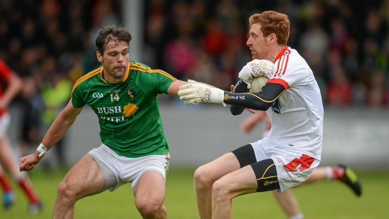 Leitrim full-forward Donal Wrynn challenges Craig Lynch
