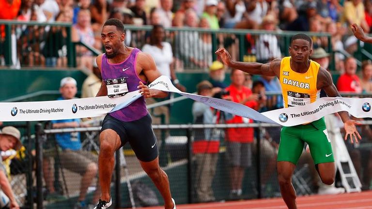 Tyson Gay crosses the finish line ahead of  Trayvon Bromell. 