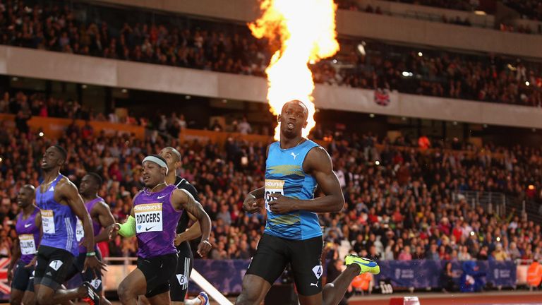 Usain Bolt of Jamaica crosses the line to win 100m 